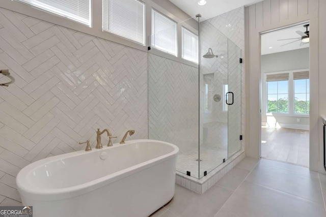 1130 Lupo Loop, Chattahoochee Hills, GA 30268 - bathroom featuring a shower stall, a freestanding tub, tile patterned floors, vanity, and ceiling fan
