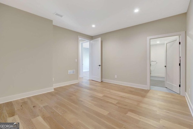 1130 Lupo Loop, Chattahoochee Hills, GA 30268 - empty room with light wood-style floors and recessed lighting