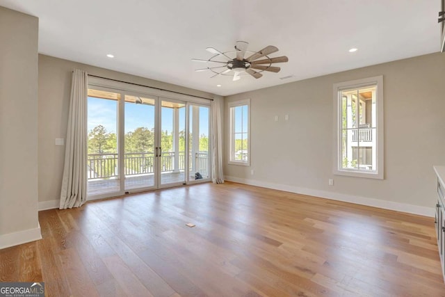 1130 Lupo Loop, Chattahoochee Hills, GA 30268 - empty room featuring healthy amount of natural light, light wood finished floors, ceiling fan, recessed lighting, and french doors