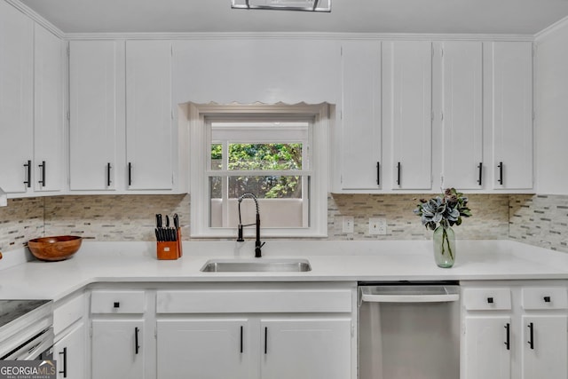 kitchen featuring tasteful backsplash, dishwasher, a sink, and white cabinets