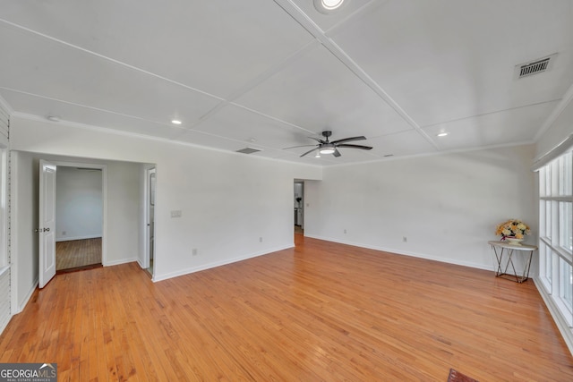 empty room featuring light wood-type flooring, baseboards, recessed lighting, a ceiling fan, and visible vents