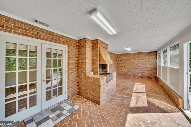 unfurnished sunroom with french doors and visible vents