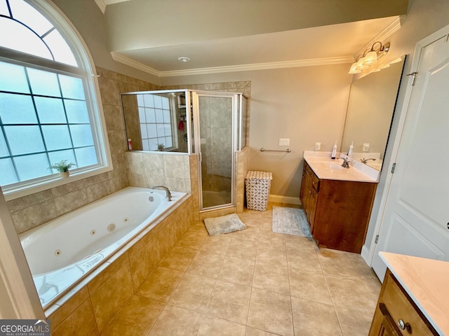 bathroom with vanity, tile patterned flooring, crown molding, a shower stall, and a tub with jets