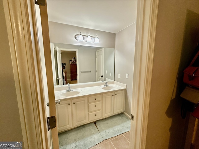 bathroom featuring a sink, tile patterned floors, and double vanity