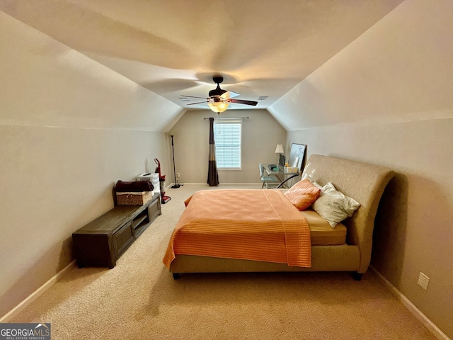 bedroom featuring carpet floors, ceiling fan, vaulted ceiling, and baseboards