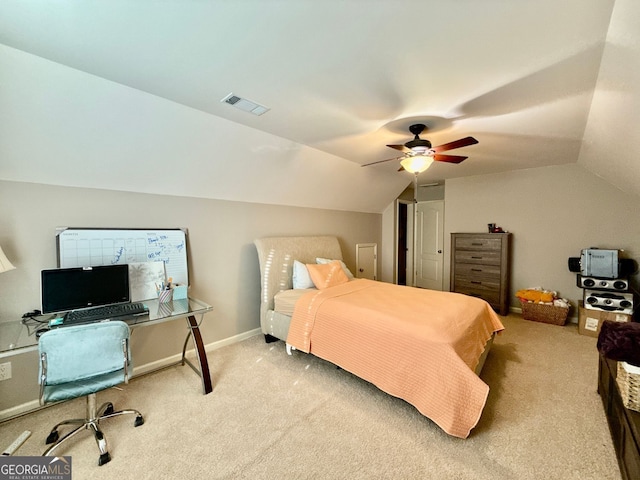 carpeted bedroom with visible vents, ceiling fan, vaulted ceiling, and baseboards