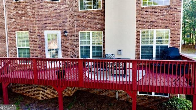 wooden deck with grilling area