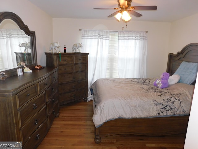 bedroom featuring wood finished floors and ceiling fan