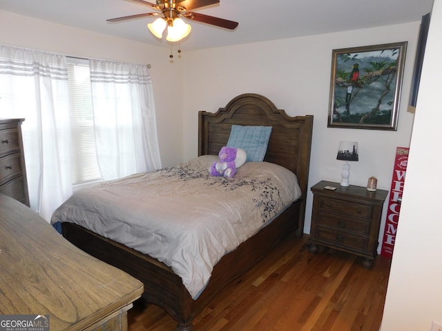 bedroom with ceiling fan and wood finished floors