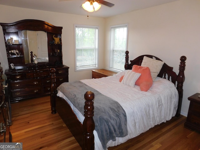 bedroom with wood finished floors and ceiling fan