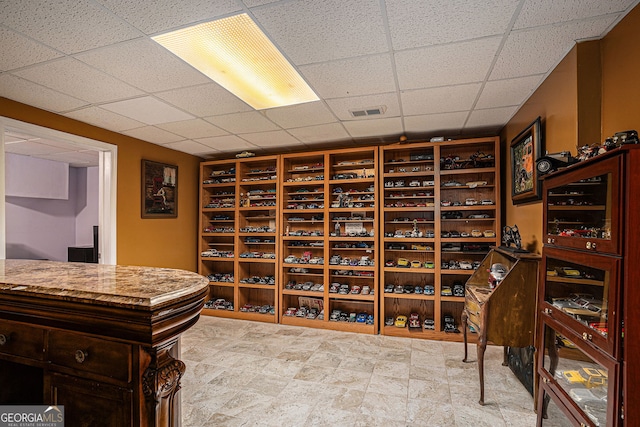 wine area with visible vents and a paneled ceiling
