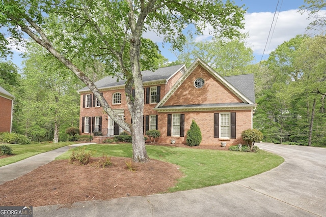918 Guinevere Way SW, Lilburn, GA 30047 - colonial inspired home with brick siding and a front lawn
