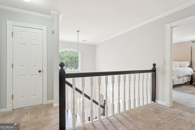 918 Guinevere Way SW, Lilburn, GA 30047 - hallway with carpet floors, an upstairs landing, and ornamental molding