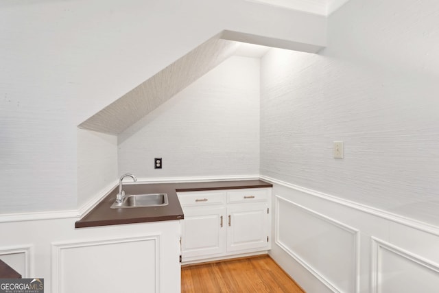 918 Guinevere Way SW, Lilburn, GA 30047 - washroom with a sink and light wood-style floors