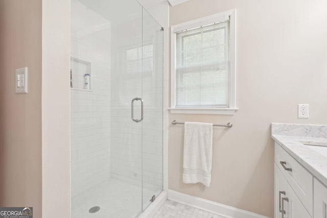918 Guinevere Way SW, Lilburn, GA 30047 - bathroom with a stall shower, vanity, tile patterned flooring, and healthy amount of natural light
