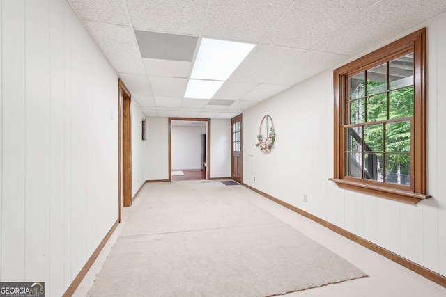 918 Guinevere Way SW, Lilburn, GA 30047 - hallway with a drop ceiling, light colored carpet, and wooden walls