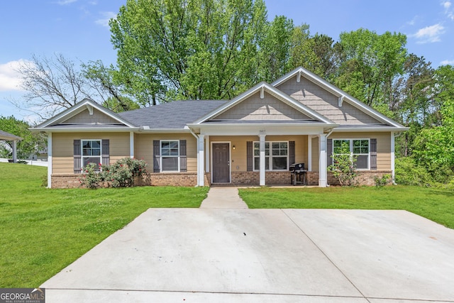 8405 Military Way, Douglasville, GA 30134 - craftsman-style home featuring a front yard, brick siding, and covered porch