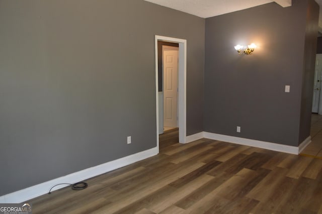 66 Topaz Ln, Royston, GA 30662 - spare room featuring dark wood-style flooring and baseboards