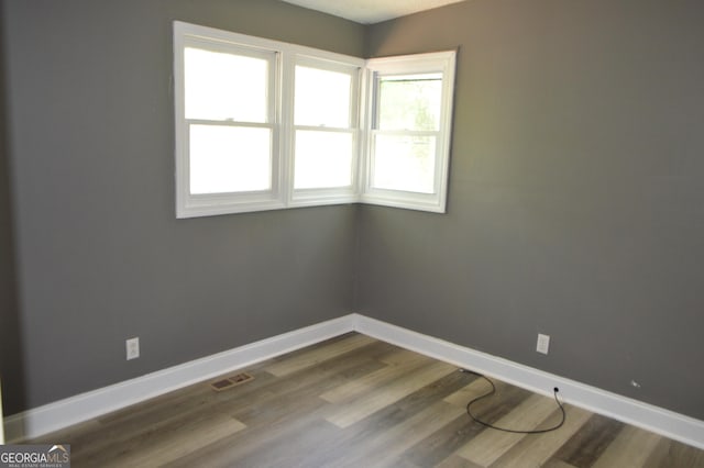 66 Topaz Ln, Royston, GA 30662 - empty room with visible vents, baseboards, and wood finished floors