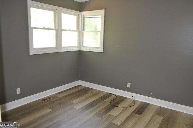 66 Topaz Ln, Royston, GA 30662 - unfurnished room with visible vents, baseboards, and dark wood finished floors