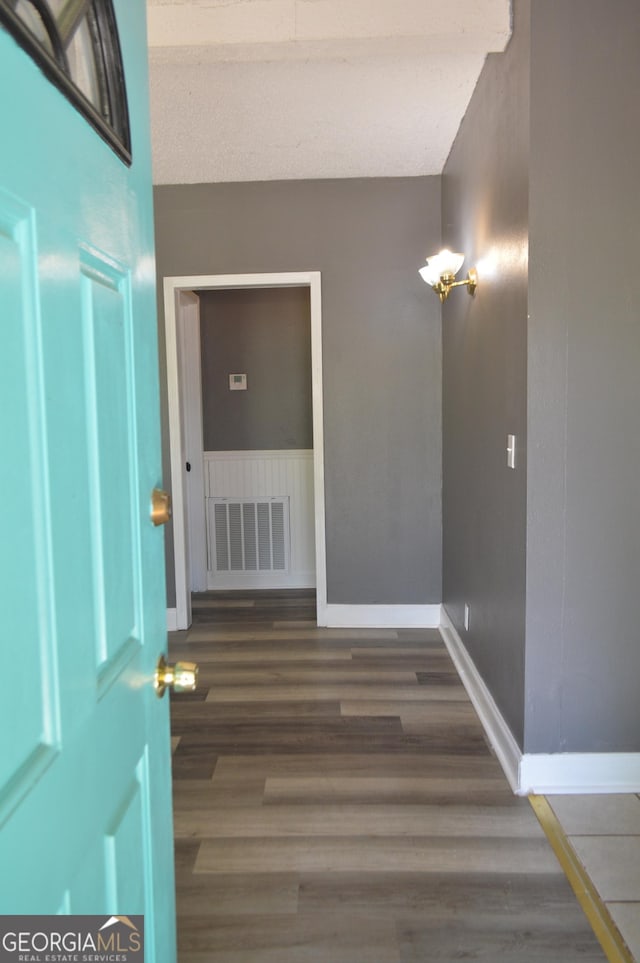 66 Topaz Ln, Royston, GA 30662 - corridor with visible vents, baseboards, and wood finished floors