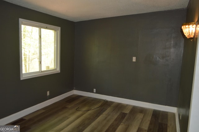 66 Topaz Ln, Royston, GA 30662 - spare room with baseboards and dark wood-style floors
