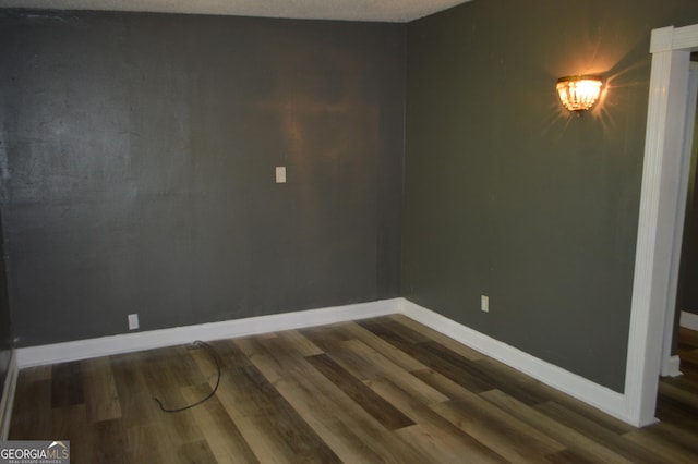 66 Topaz Ln, Royston, GA 30662 - empty room with baseboards and dark wood finished floors