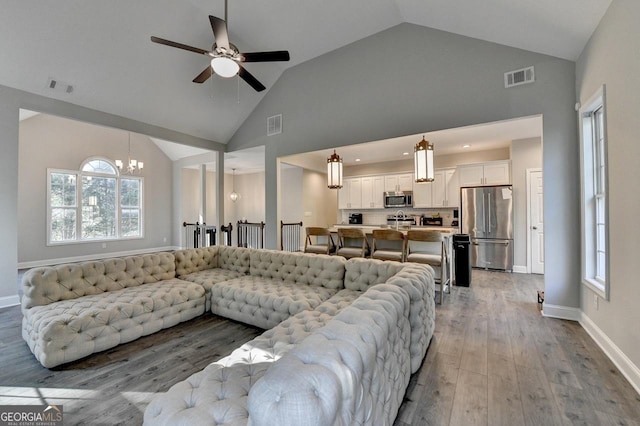 living room with visible vents and wood finished floors