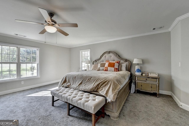 carpeted bedroom featuring crown molding, baseboards, and visible vents