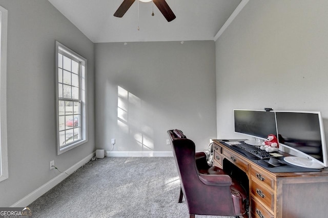 office space with baseboards, a ceiling fan, carpet, and a wealth of natural light
