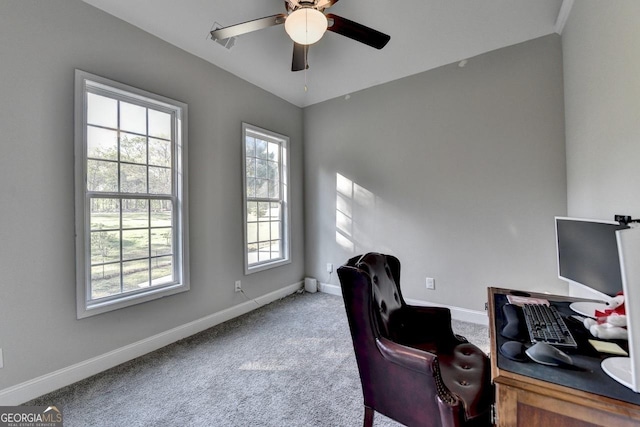 home office with baseboards, a ceiling fan, and carpet
