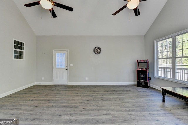 spare room featuring high vaulted ceiling, a ceiling fan, and a wealth of natural light