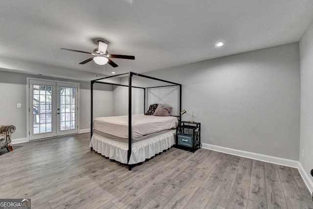 bedroom with recessed lighting, french doors, baseboards, and wood finished floors