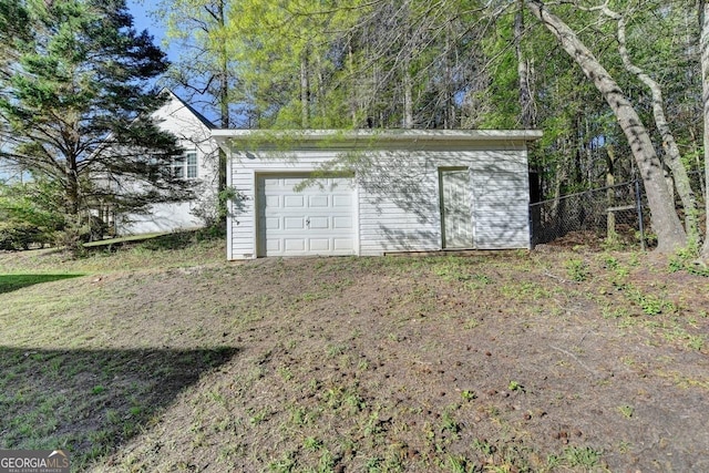 garage featuring fence