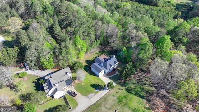 bird's eye view featuring a forest view