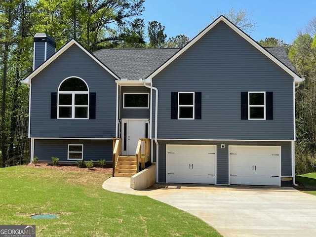202 Gamel Rd, Dallas, GA 30157 - split foyer home with a front yard, driveway, a chimney, and an attached garage