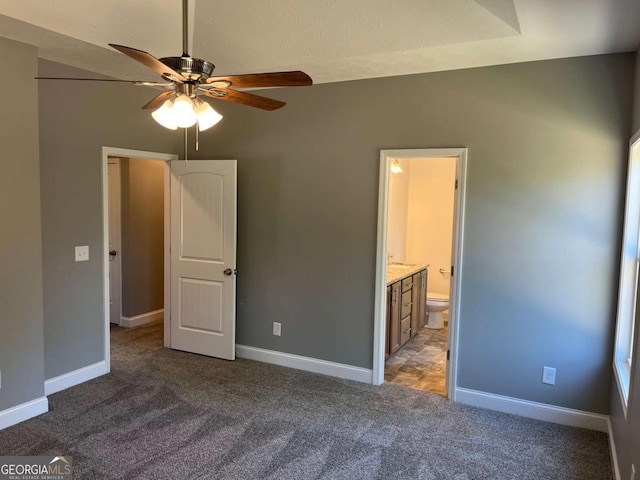 202 Gamel Rd, Dallas, GA 30157 - unfurnished bedroom featuring ceiling fan, baseboards, connected bathroom, and carpet floors
