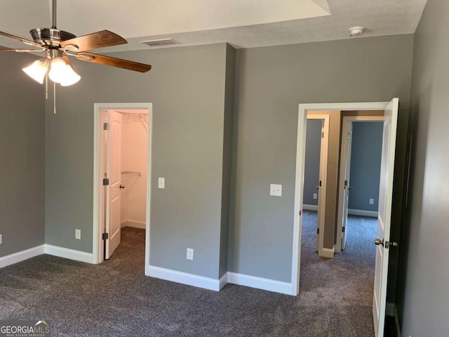 202 Gamel Rd, Dallas, GA 30157 - unfurnished bedroom with a spacious closet, visible vents, baseboards, and carpet flooring
