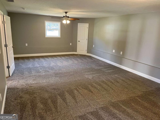 202 Gamel Rd, Dallas, GA 30157 - spare room featuring dark carpet, baseboards, and a ceiling fan