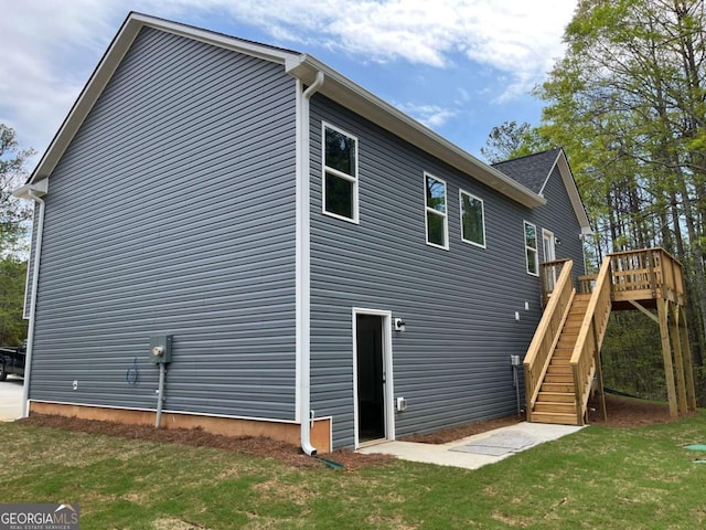 202 Gamel Rd, Dallas, GA 30157 - back of house featuring a yard, a wooden deck, and stairs