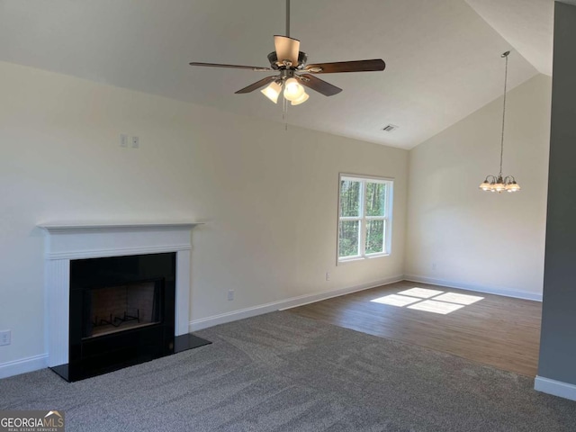 202 Gamel Rd, Dallas, GA 30157 - unfurnished living room featuring visible vents, baseboards, carpet, a fireplace, and ceiling fan with notable chandelier