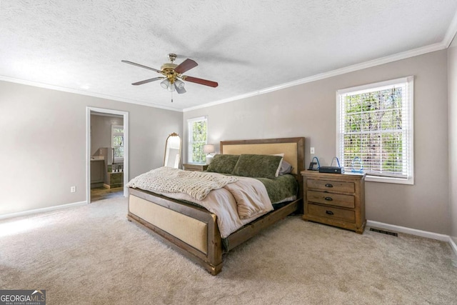 bedroom featuring baseboards, multiple windows, crown molding, and carpet floors