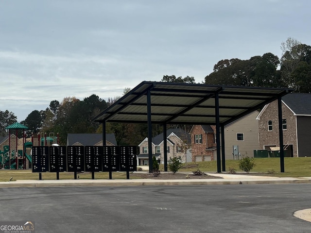 view of property's community with mail area and playground community