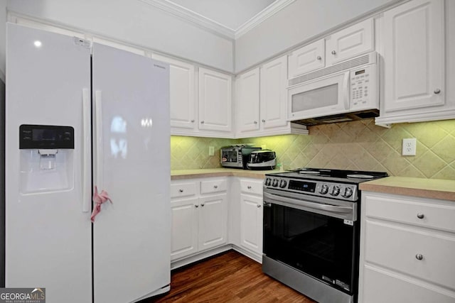 kitchen with crown molding, light countertops, white appliances, and white cabinets