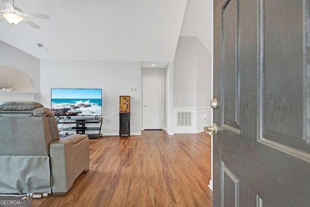 entrance foyer featuring visible vents, ceiling fan, baseboards, and wood finished floors