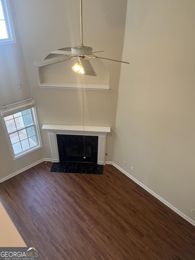 2127 Manhattan Pkwy, Decatur, GA 30035 - unfurnished living room with baseboards, ceiling fan, dark wood finished floors, and a premium fireplace