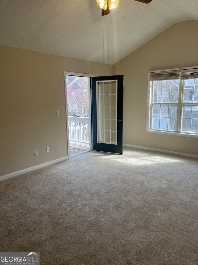 2127 Manhattan Pkwy, Decatur, GA 30035 - unfurnished room featuring a textured ceiling, carpet, a ceiling fan, baseboards, and vaulted ceiling