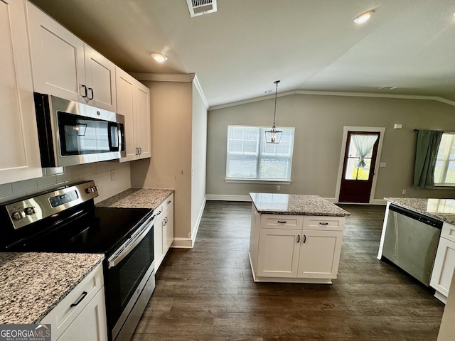 1037 E Doyle St, Toccoa, GA 30577 - kitchen with appliances with stainless steel finishes, plenty of natural light, ornamental molding, lofted ceiling, and white cabinets