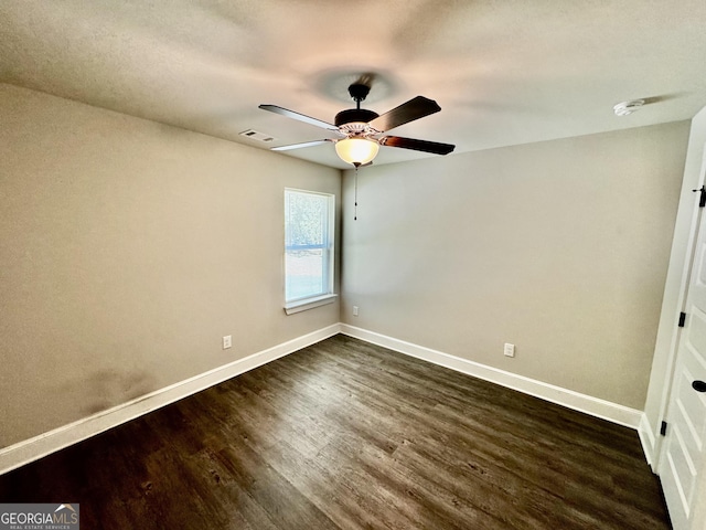 1037 E Doyle St, Toccoa, GA 30577 - spare room featuring dark wood-type flooring, a ceiling fan, and a smoke detector