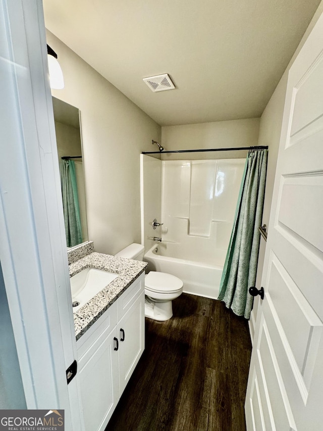 1037 E Doyle St, Toccoa, GA 30577 - bathroom featuring vanity, wood finished floors, and shower / bath combo with shower curtain